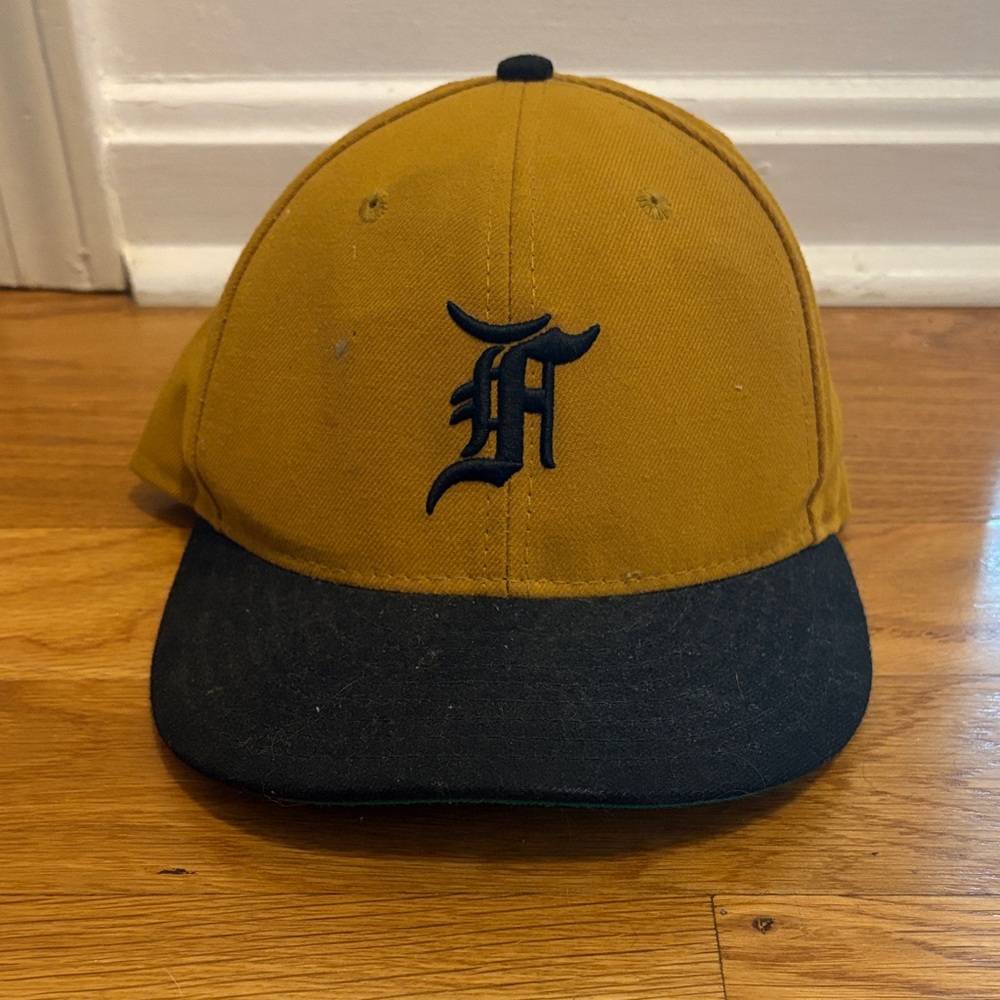 Fear of God Mustard Yellow and Black Baseball Cap with Gothic 'F'